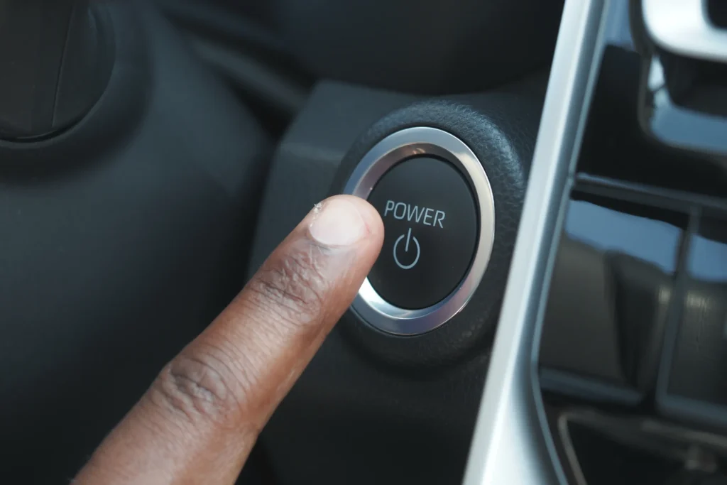 finger-pressing-power-button-in-modern-vehicle-int-2025-02-12-22-58-15-utc