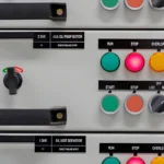A clear view of an industrial control panel featuring push buttons, indicator lights (RUN, STOP, OVERLOAD), and a selector switches